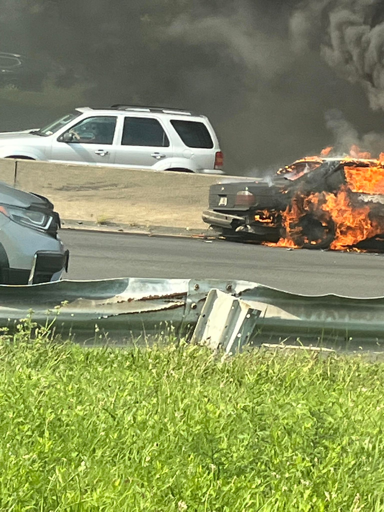 Car fire on the Belt Parkway eastbound near the JFK airport.